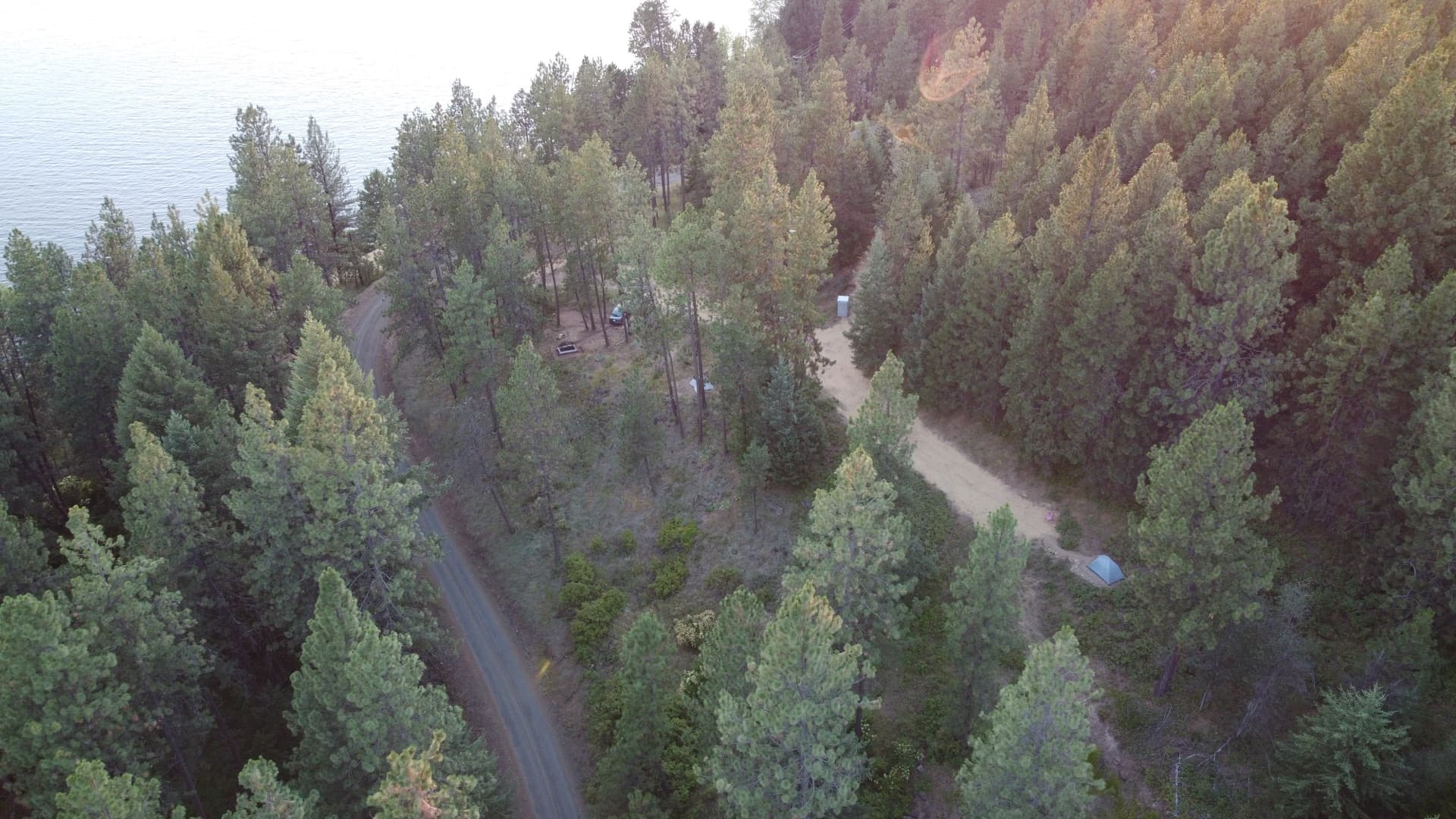 Aerial view of campground road, sites, and lakeshore